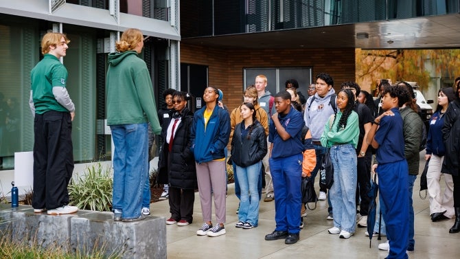 Students gather outside of library
